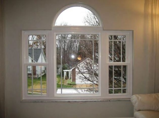 arched window with white trim in fenton, mo