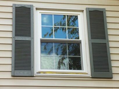 window with black shutters in chesterfield, mo