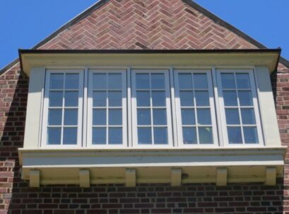 Home exterior features Chesterfield, MO window replacement service with classic grid-pattern windows that add charm, symmetry, and timeless curb appeal