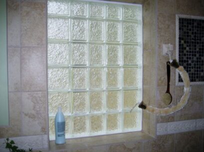 Bathroom glass block feature offers privacy and soft natural light, making it a stylish option for window replacement St. Louis, MO projects