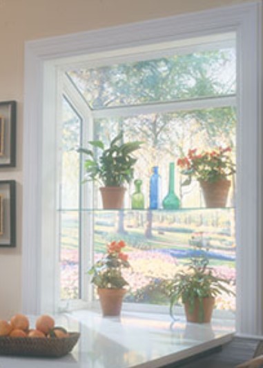A bright garden window with potted plants adds charm and natural light through Fenton, MO window replacement