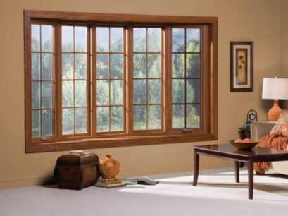 Living room features elegant wood-framed windows installed through a Chesterfield, MO window replacement service