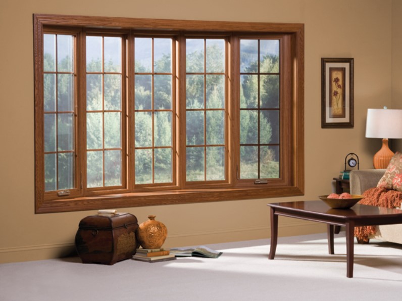 living-room-features-elegant-wood-framed-windows-in-chesterfield-mo Living room features elegant wood-framed windows installed through a Chesterfield, MO window replacement service