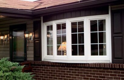 White bay windows enhance this brick home with bright style after Fenton, MO window replacement