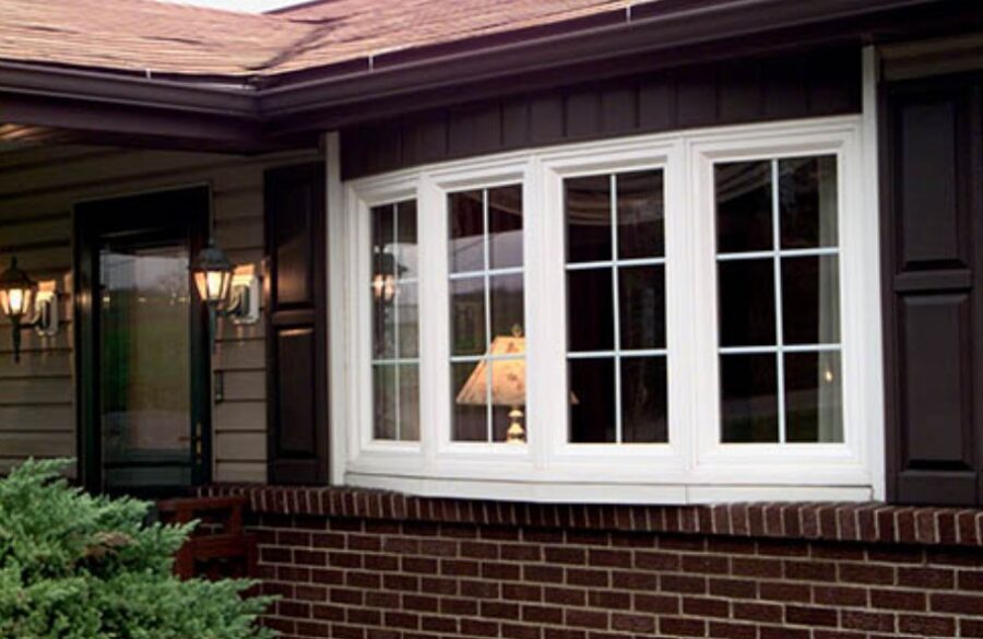 White bay windows enhance this brick home with bright style after Fenton, MO window replacement